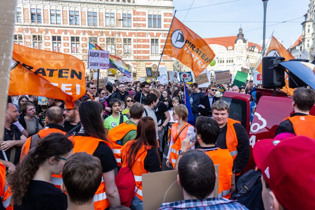 PrErfurt, Germany – Mar. 23, 2019: Flags of the german "Piratenpartei" at protest march demonstration demo rally against new copyright law by European union, namely “Artikel 13”.